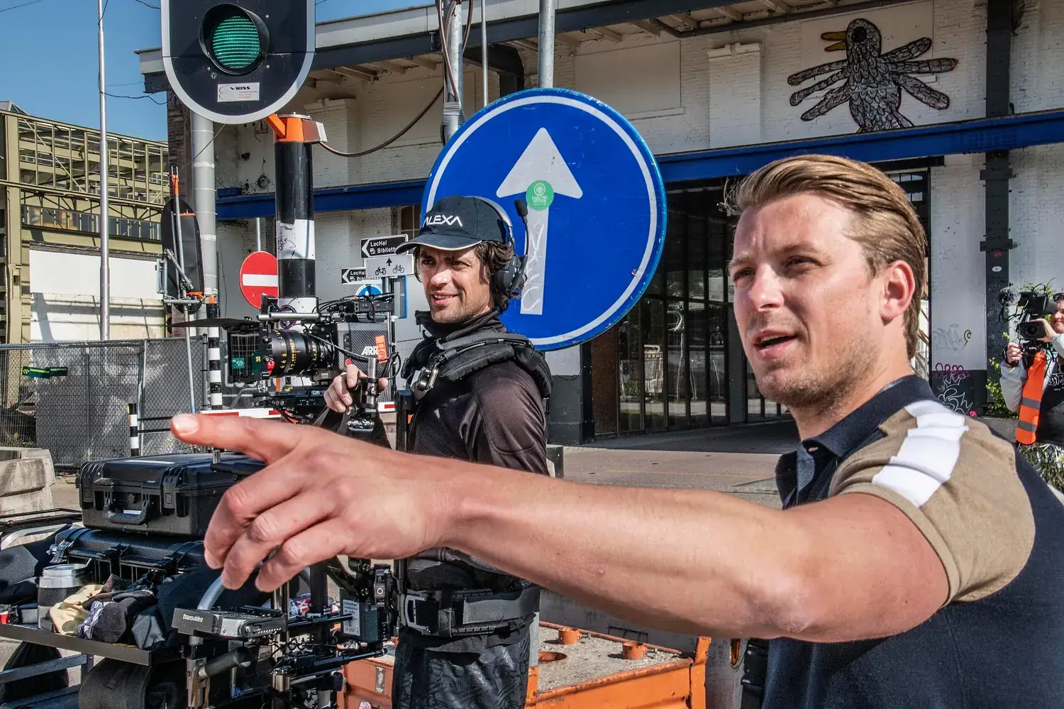 Loek Luijbregts directing a camera crew on location